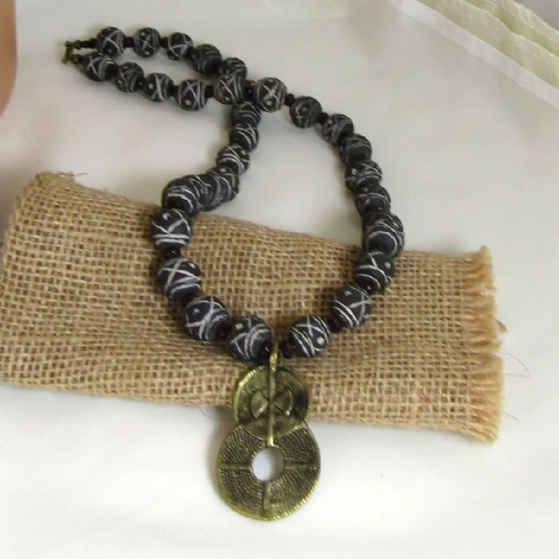 Best necklaces and pendants with emerald gemstones for a rich, sophisticated design-Terracotta Black Beaded Necklace Brass Pendant