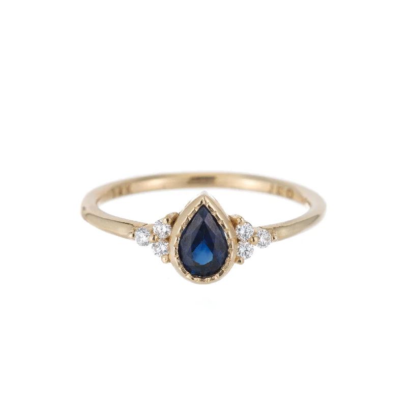 Rings with moonstone gems for ethereal glow -Blue Sapphire Pear Diamond Cluster Ring