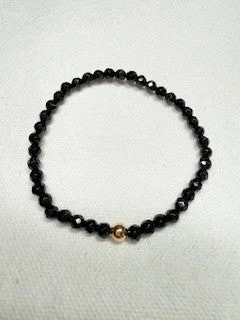 Bangles with claw-set tourmaline for vibrancy -Black Onyx Faceted Bracelet with Gold Filled Bead