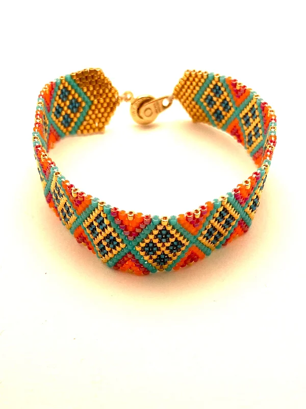 Bracelets with knot accents for symbolic charm -Beaded Chevron Bracelet, Turquoise and Orange