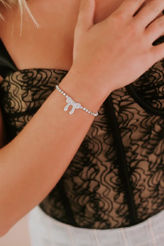 Bracelets with wave engravings for ocean vibes -Rhinestone Studded Bracelet With Bow, Silver