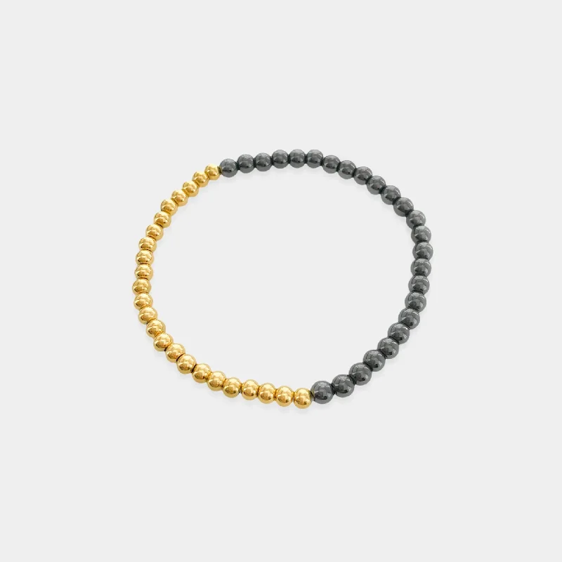 Bangles with sleek matte finish for subtlety -Gold and Hematite Beaded Stretch Bracelet